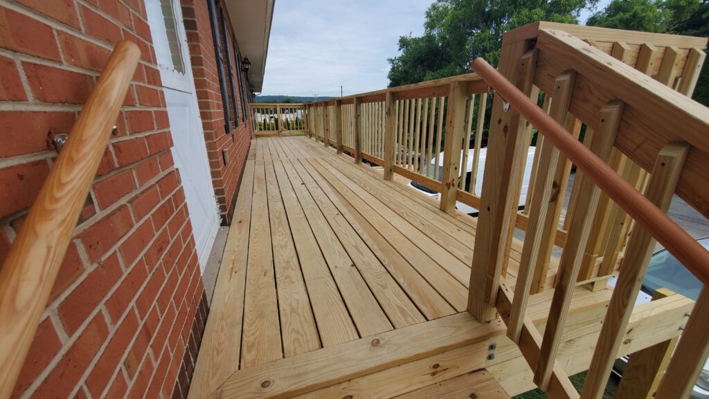 New outdoor stairs and deck constructed by PA HomeBase