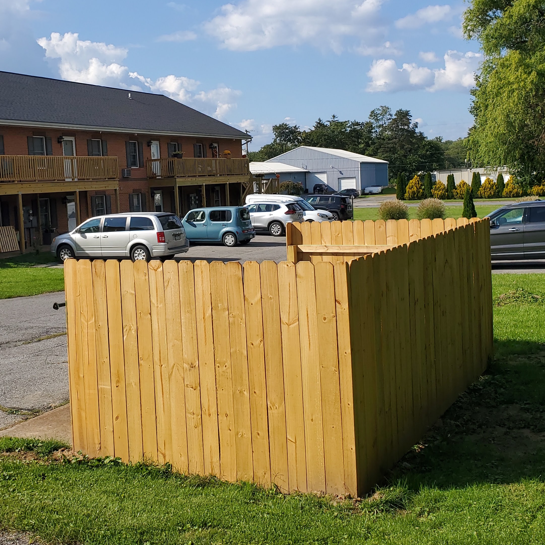 Fence project constructed by PA HomeBase to create a visually pleasing perimeter around recycling and trash cans
